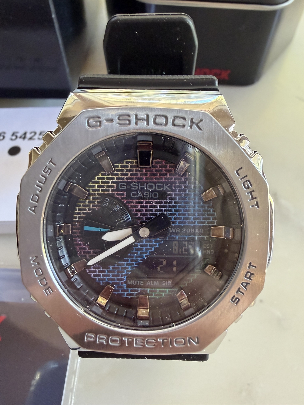 Casio G-SHOCK Silver Watch with Blue, Pink and Purple Dial